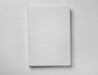 Photo of Mockup of hardcover book on white background, top view