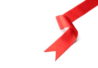 Simple red ribbon on white background, top view. Festive decoration