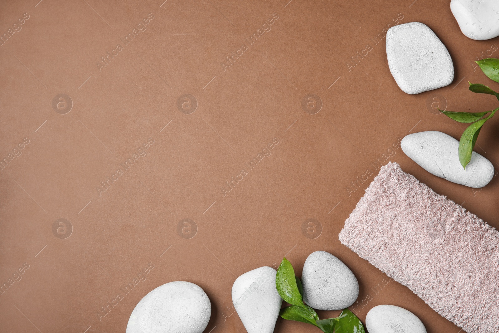 Photo of Flat lay composition with spa stones and space for text on color background