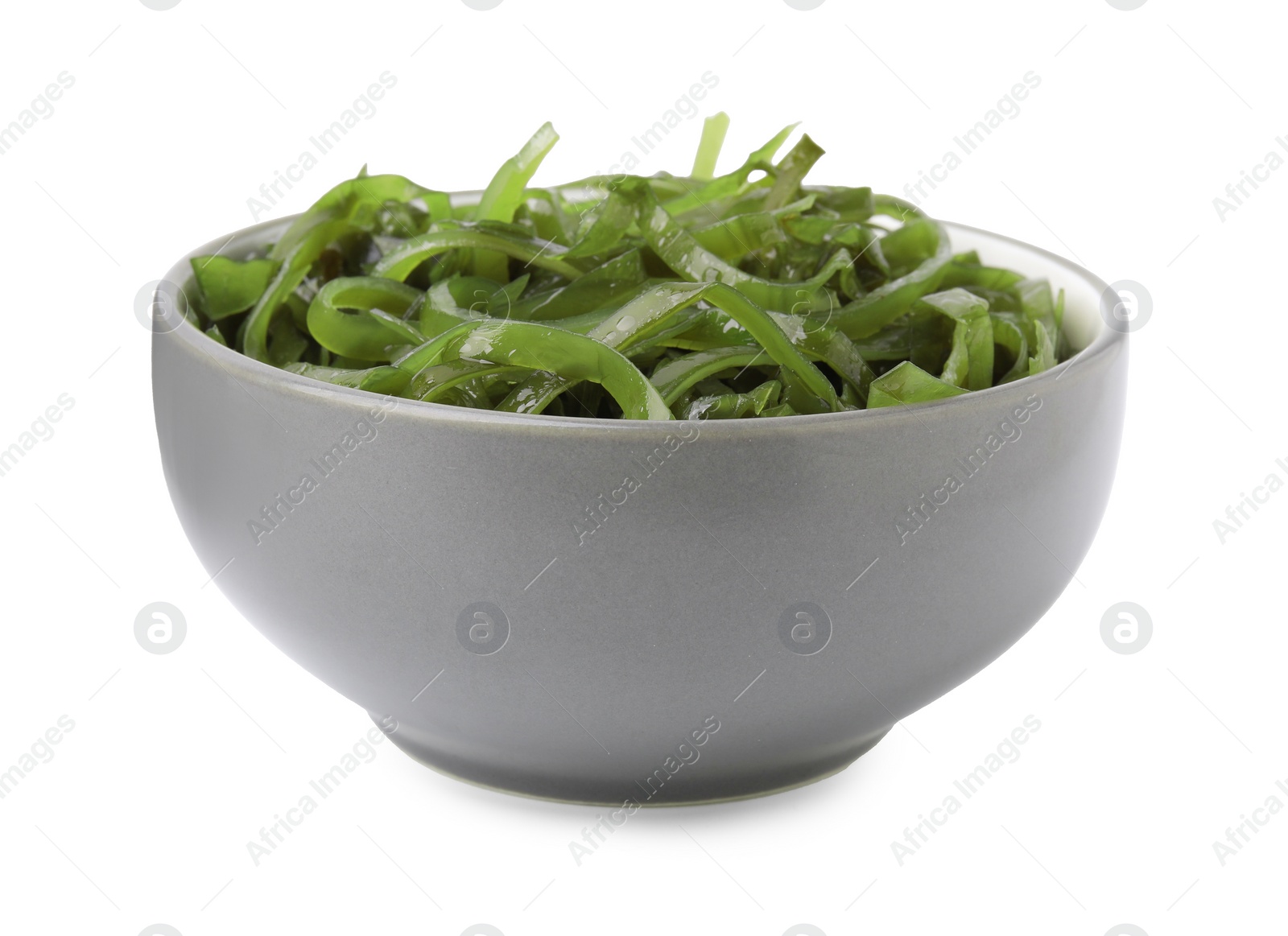 Photo of Tasty seaweed salad in bowl isolated on white