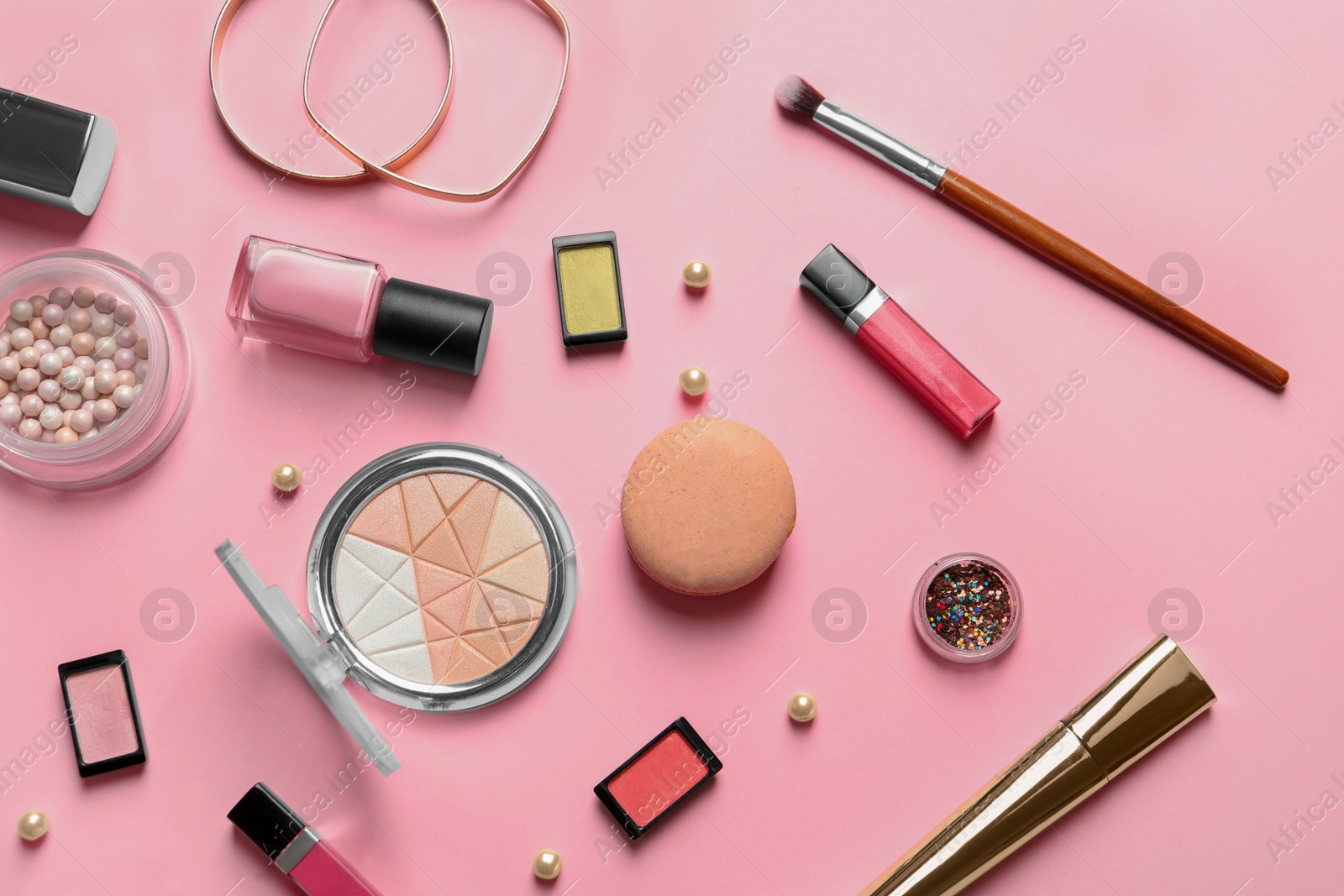 Photo of Decorative cosmetics and tools of professional makeup artist on color background