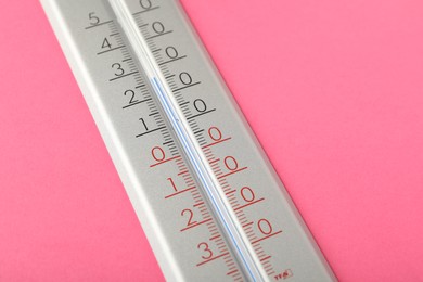 Photo of Weather thermometer on pink background, closeup. Space for text