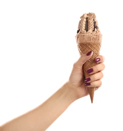 Woman holding yummy ice cream on white background. Focus on hand