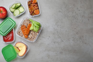 Photo of Set of plastic containers with fresh food on light grey table, flat lay. Space for text