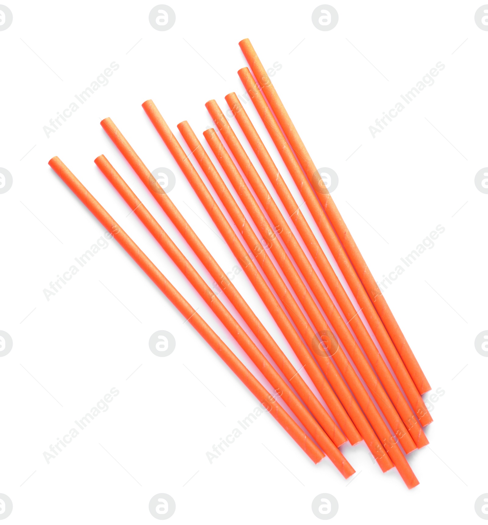 Photo of Orange paper cocktail straws on white background, top view