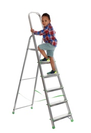 Photo of Little African-American boy climbing up ladder on white background. Danger at home