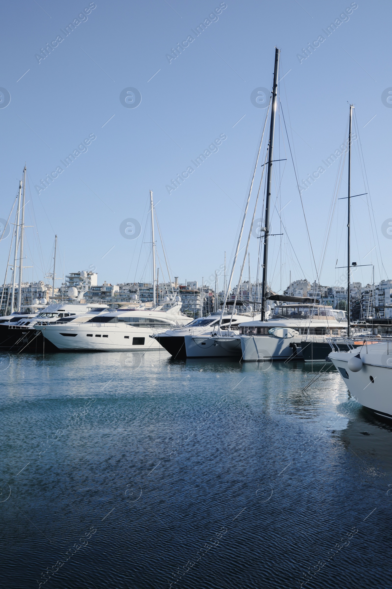 Photo of Picturesque view of port with modern boats on sunny day