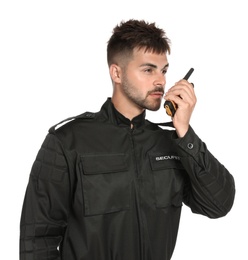 Male security guard in uniform using portable radio transmitter on white background