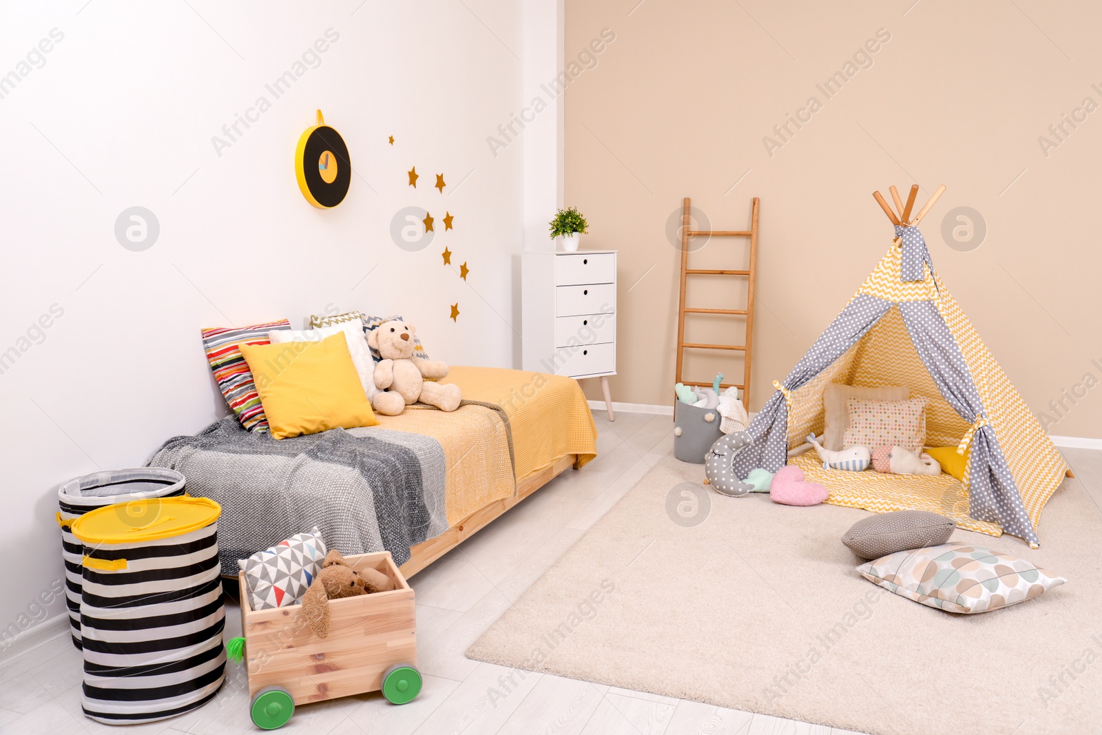 Photo of Cozy child room interior with bed, play tent and modern decor elements
