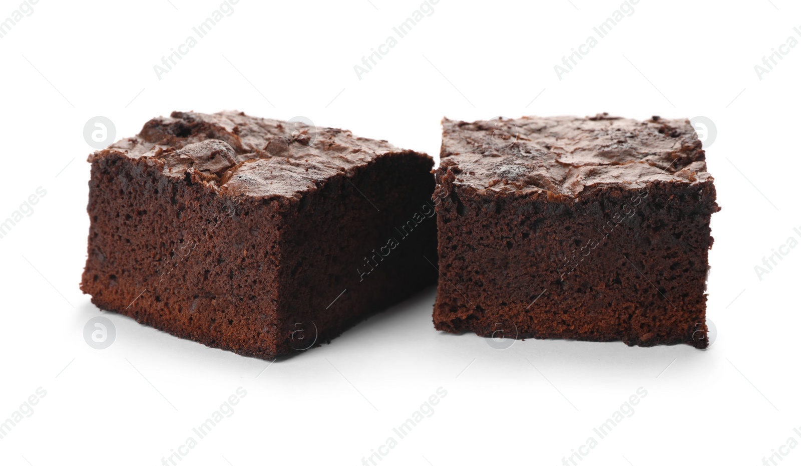 Photo of Pieces of fresh brownie on white background. Delicious chocolate pie