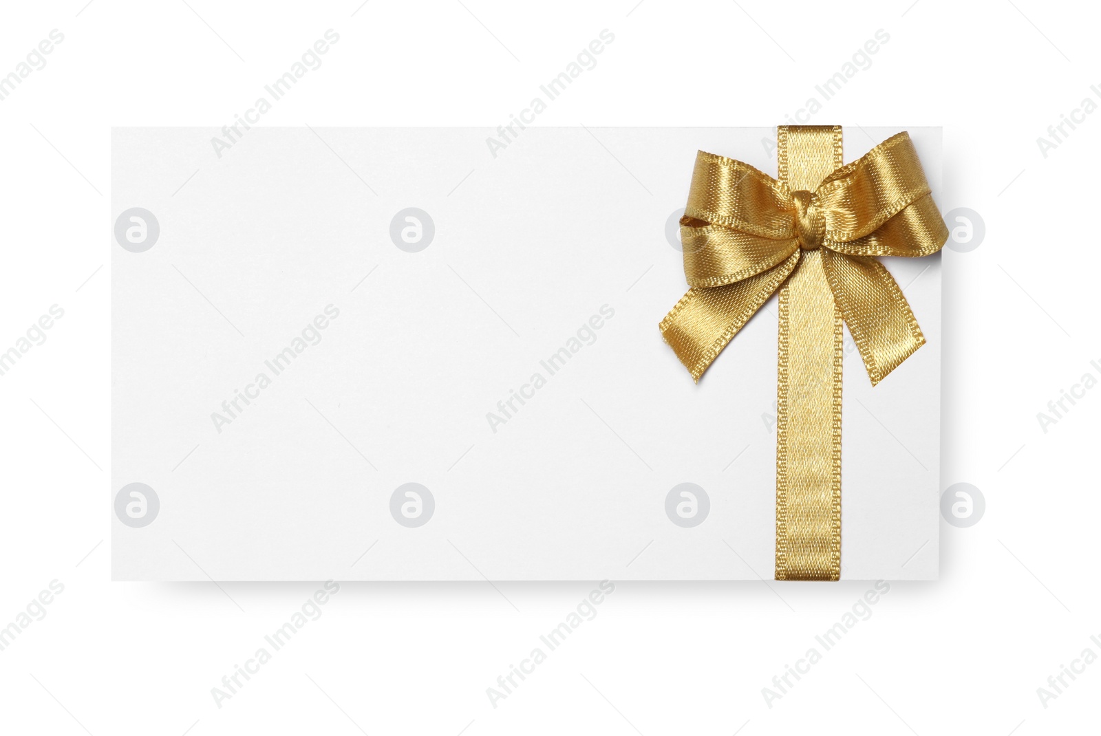 Photo of Blank gift card with golden bow isolated on white, top view