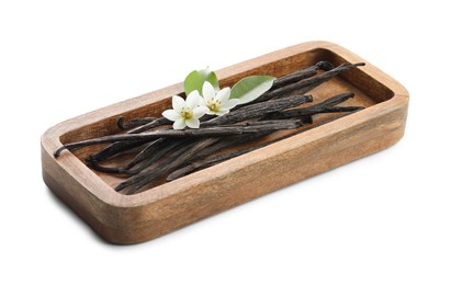 Photo of Vanilla pods, green leaves and flowers isolated on white