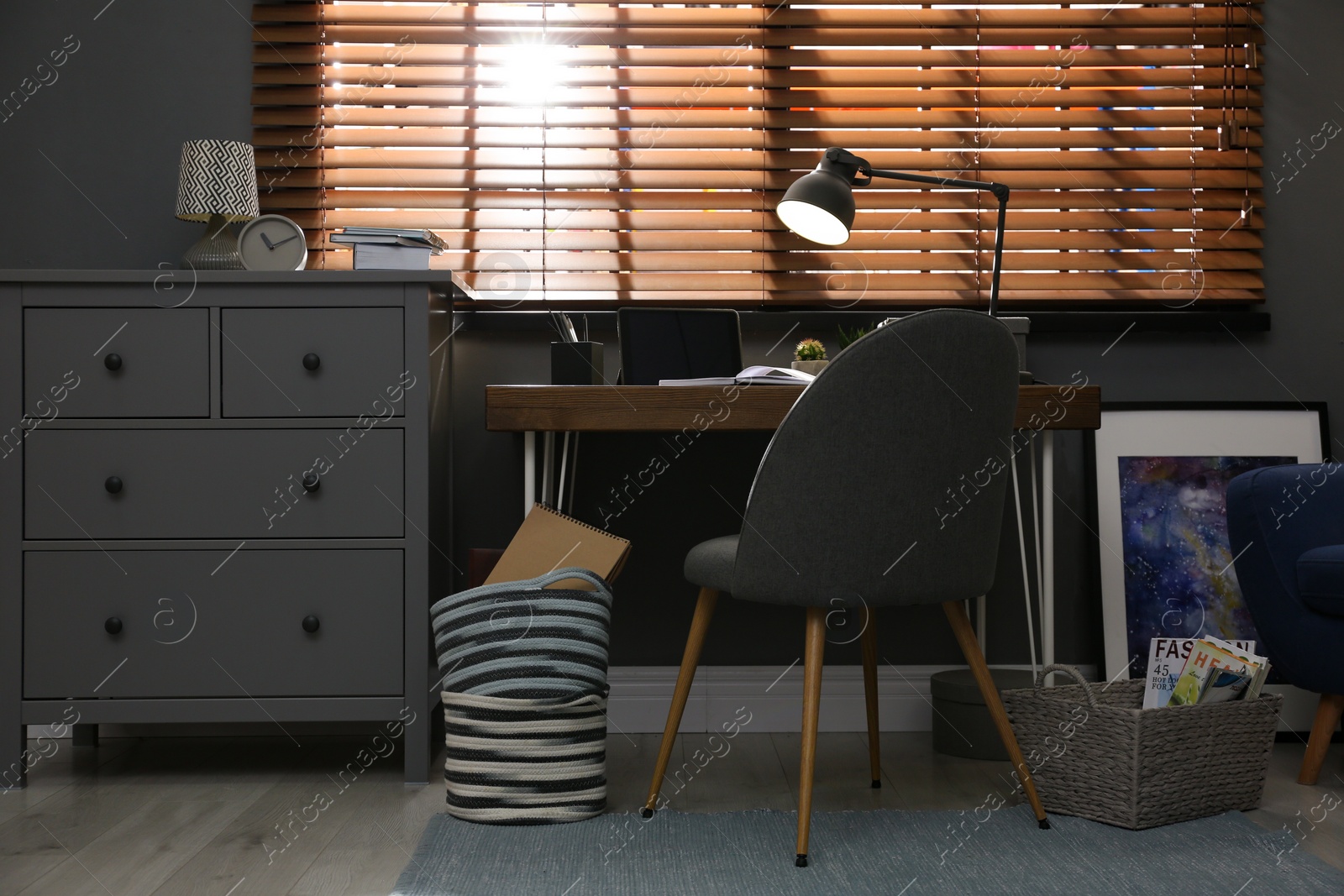 Photo of Stylish room interior with comfortable workplace near window