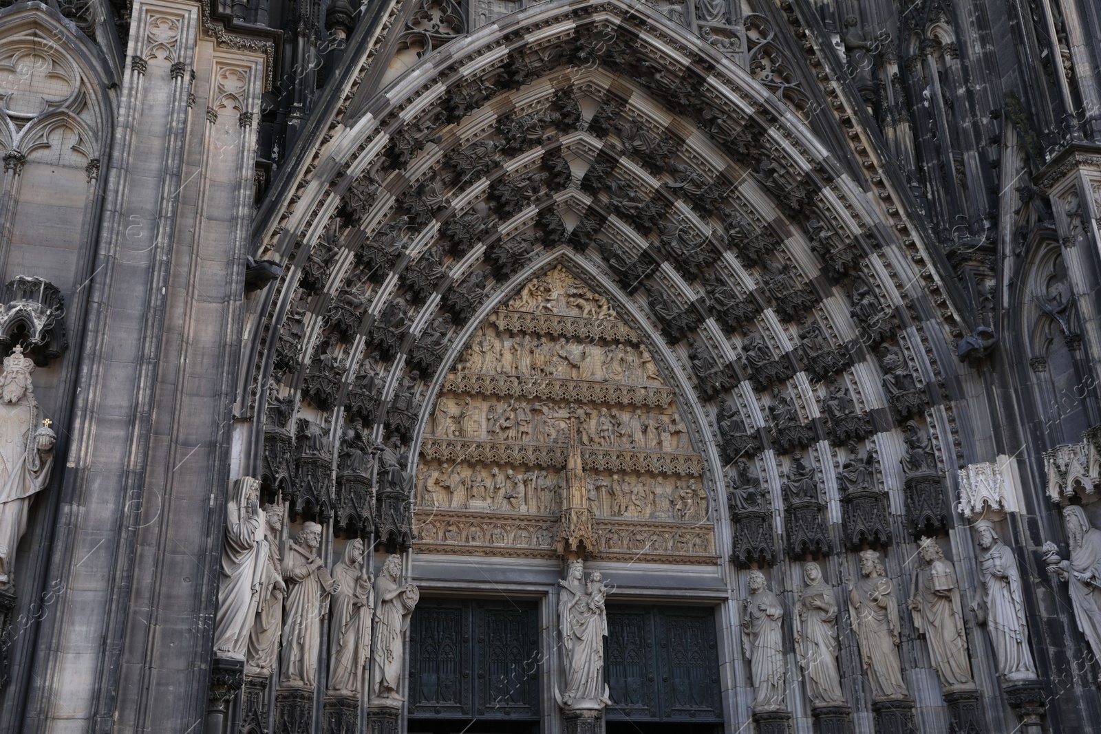 Photo of Cologne, Germany - August 28, 2022: Entrance of beautiful gothic cathedral outdoors