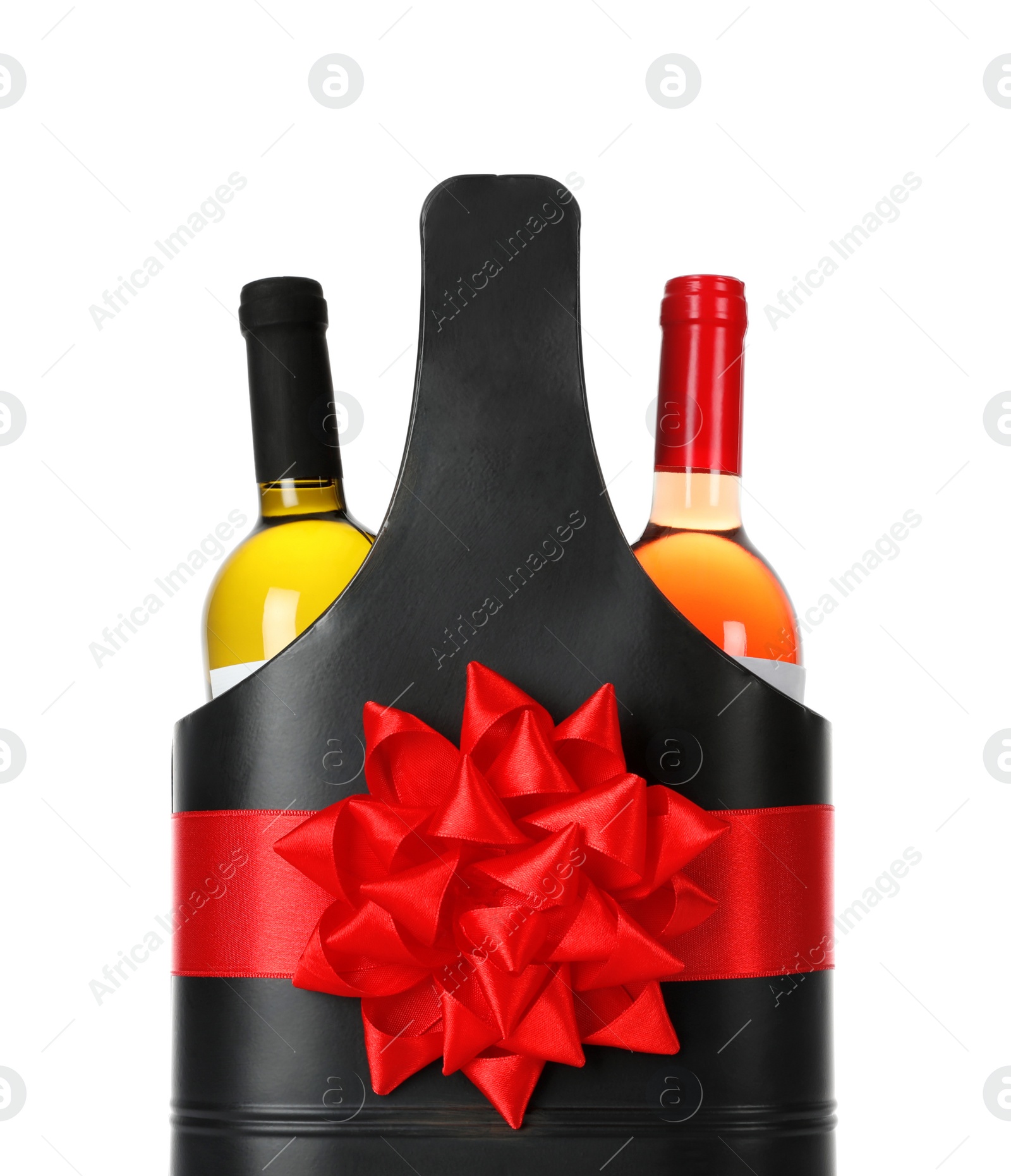 Photo of Wine bottles in festive package with red bow isolated on white