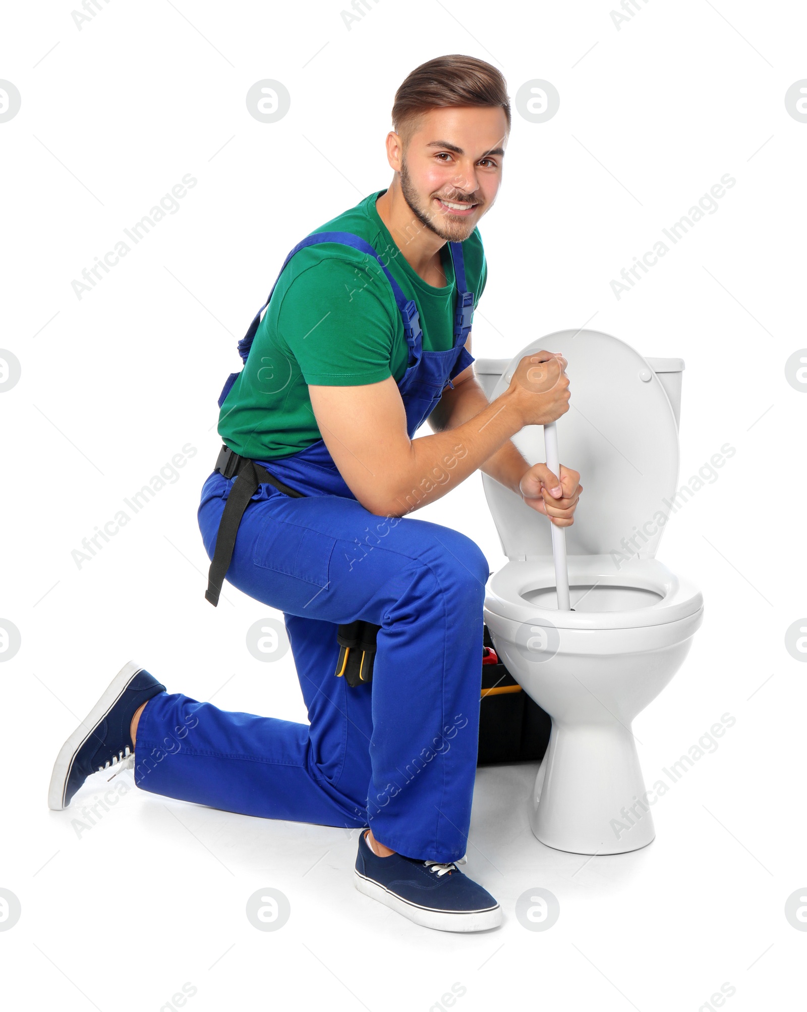 Photo of Young man working with toilet bowl, isolated on white