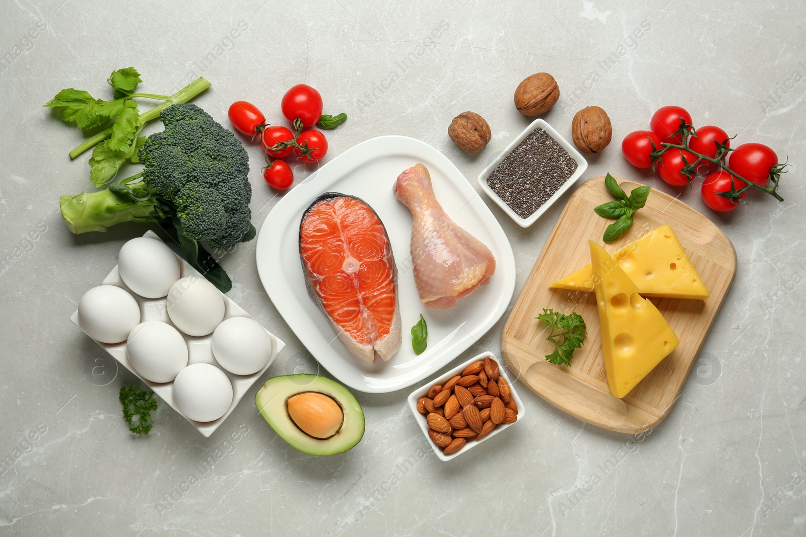 Photo of Flat lay composition with keto diet products on light grey marble table