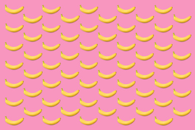 Pattern of fresh bananas on pink background
