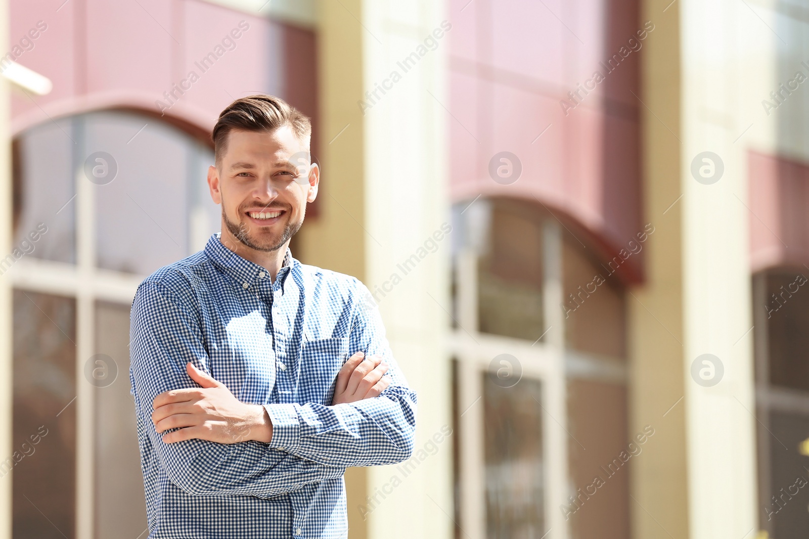 Photo of Portrait of young man in stylish outfit outdoors