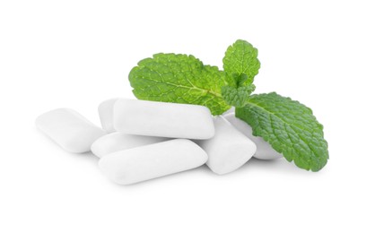 Photo of Heap of chewing gum pieces and mint on white background