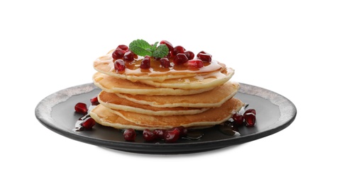 Plate with delicious pancakes on white background