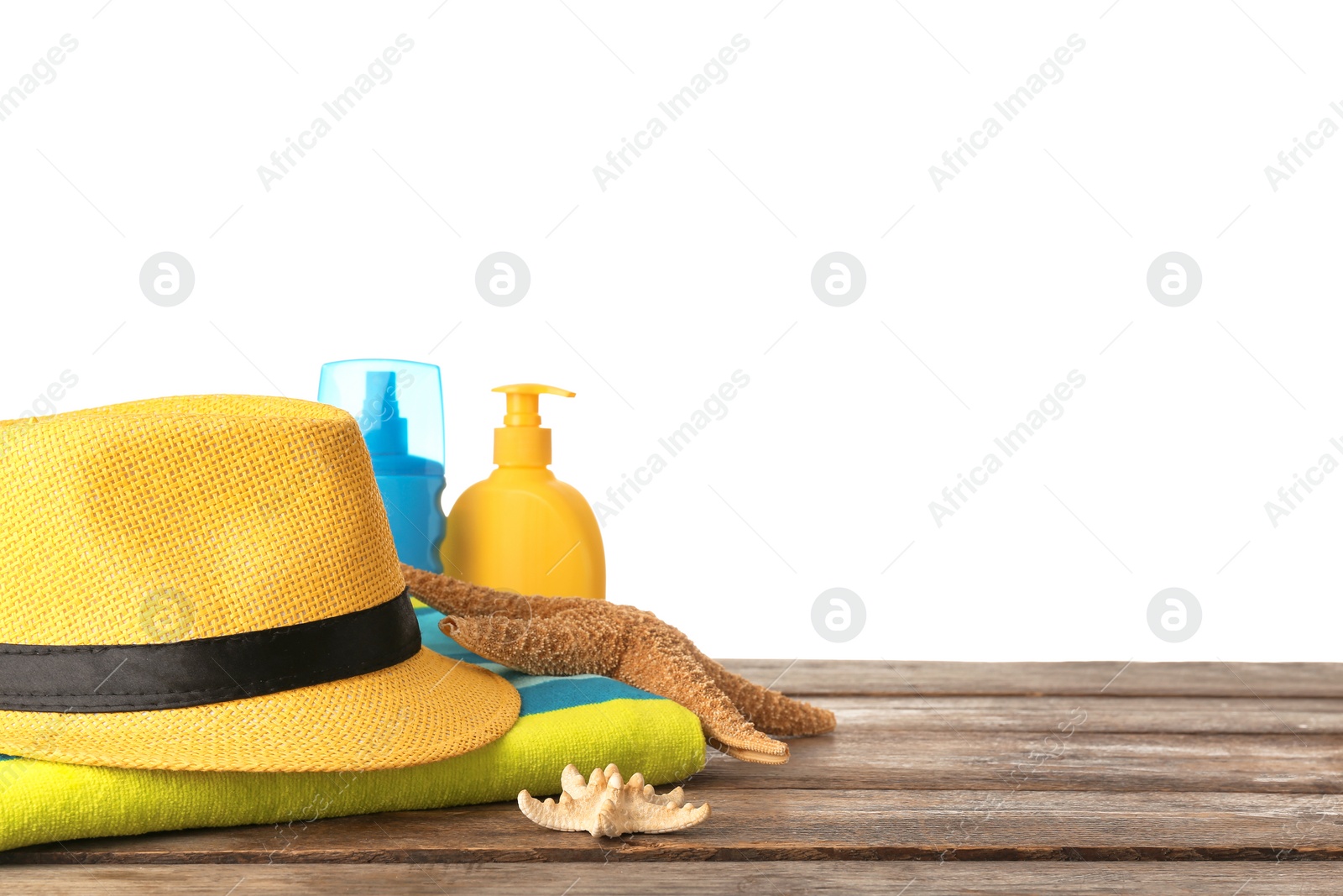 Photo of Set of different beach accessories on table against white background. Space for text