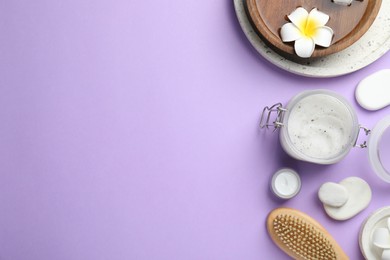Flat lay composition with body scrub and spa stones on violet background, space for text
