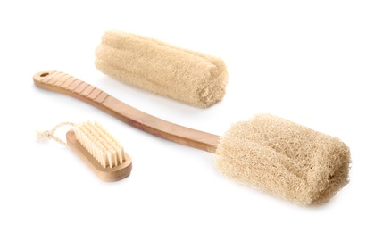 Photo of Natural shower loofah sponges and brush isolated on white