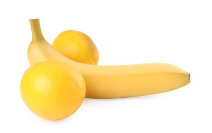 Photo of Banana and lemons symbolizing male genitals on white background. Potency concept