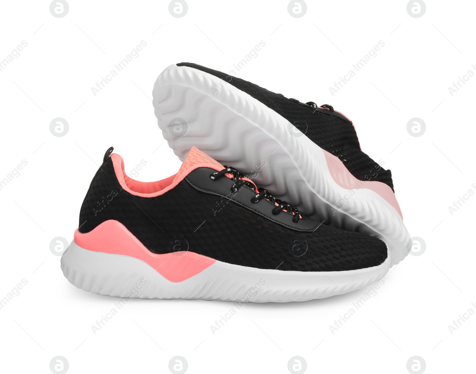 Photo of Pair of comfortable sports shoes on white background