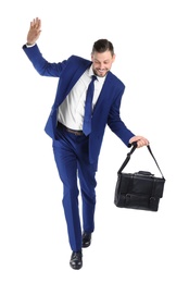 Photo of Full length portrait of businessman with briefcase balancing on white background