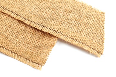 Photo of Pieces of burlap fabric isolated on white