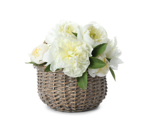 Photo of Bouquet of beautiful peonies in wicker basket isolated on white