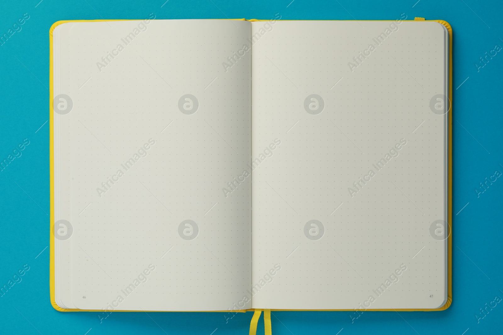 Photo of Blank notebook on light blue background, top view