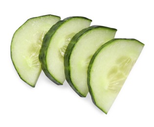 Photo of Slices of fresh cucumber isolated on white, top view