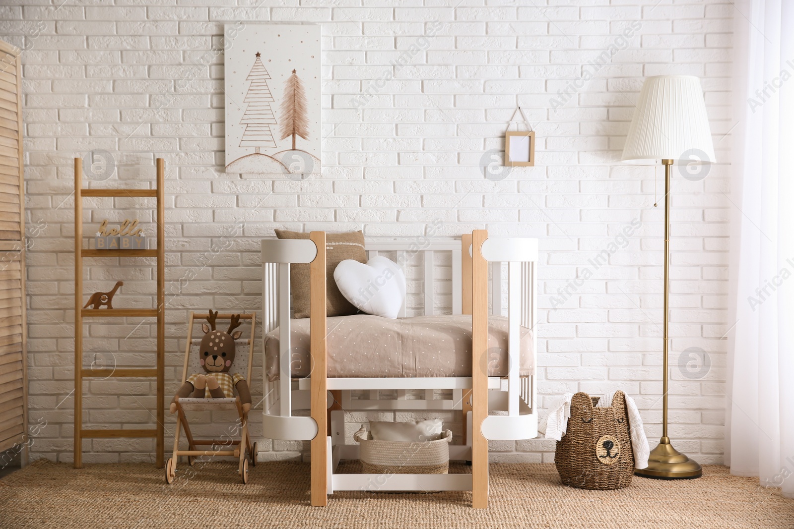 Photo of Baby room interior with toys and stylish furniture