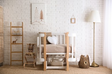 Baby room interior with toys and stylish furniture