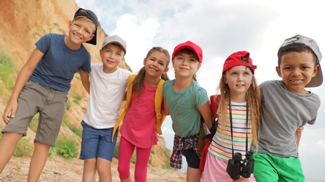 Photo of Cute little children outdoors on summer day. Camping trip