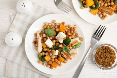 Photo of Delicious fresh chickpea salad served on white wooden table, flat lay