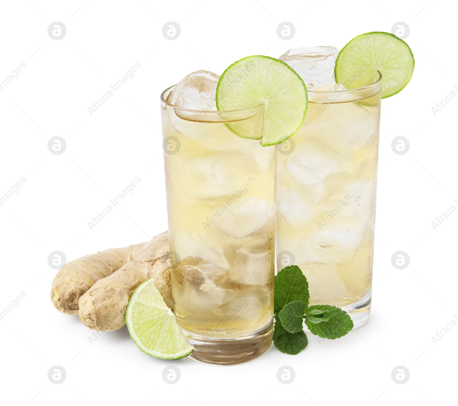 Photo of Glasses of tasty ginger ale with ice cubes and ingredients isolated on white