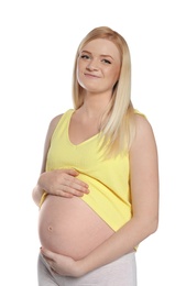 Photo of Beautiful pregnant woman showing her tummy on white background