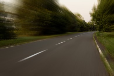 Image of Asphalt country road without transport, motion blur effect