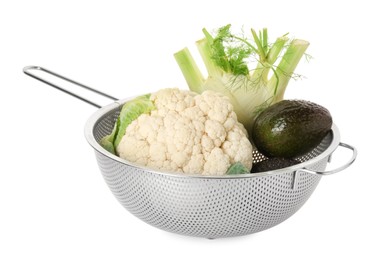 Photo of Metal colander with cauliflower, fennel and avocado isolated on white