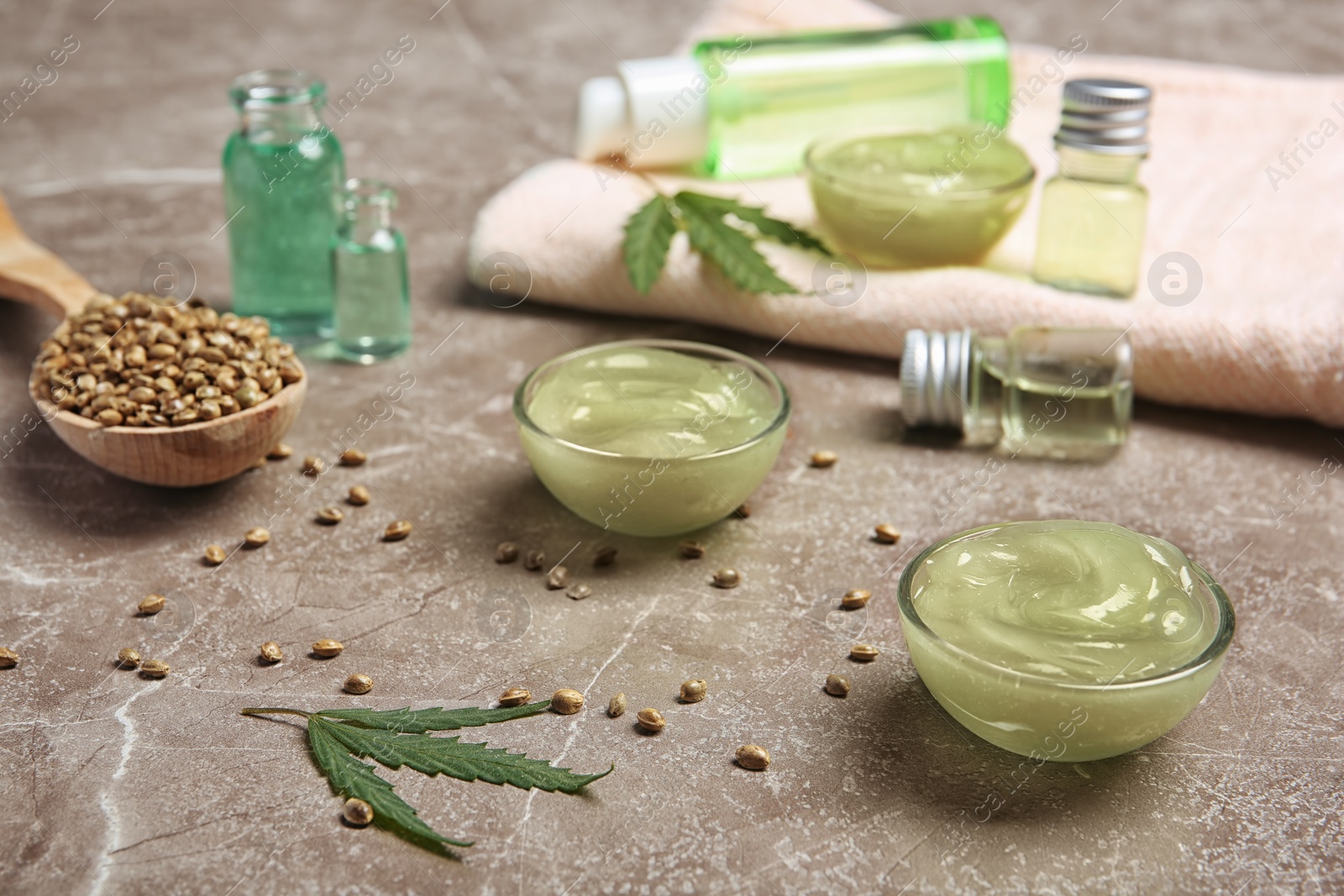 Photo of Composition with hemp lotion on grey table