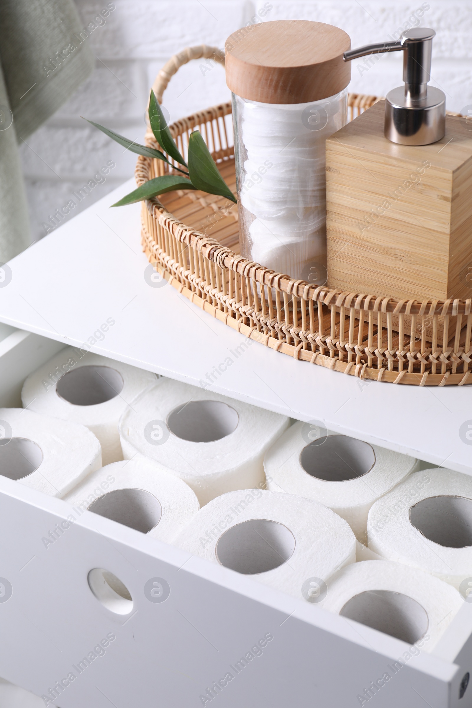 Photo of Many toilet paper rolls in white drawer indoors