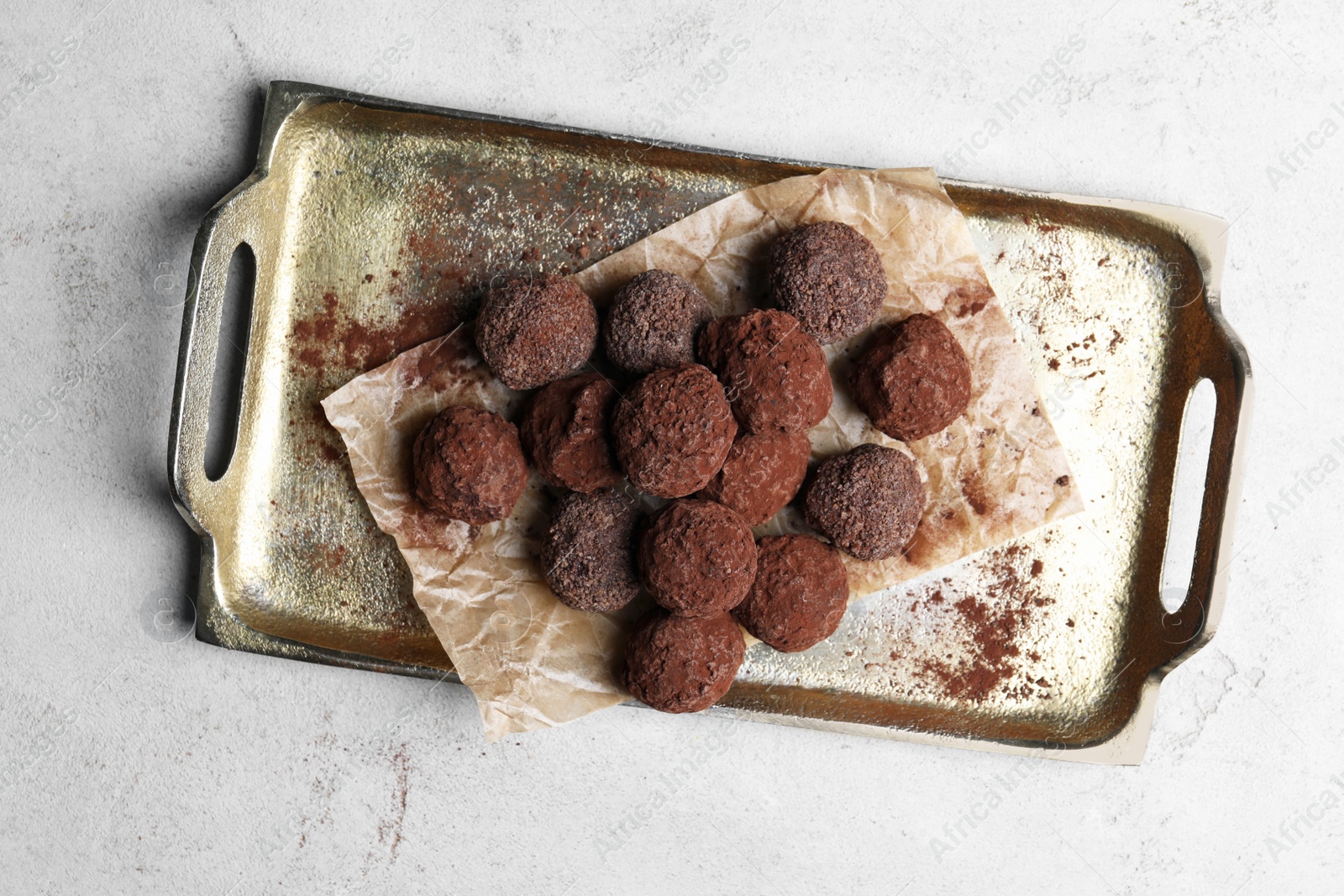 Photo of Tasty chocolate candies on white table, top view