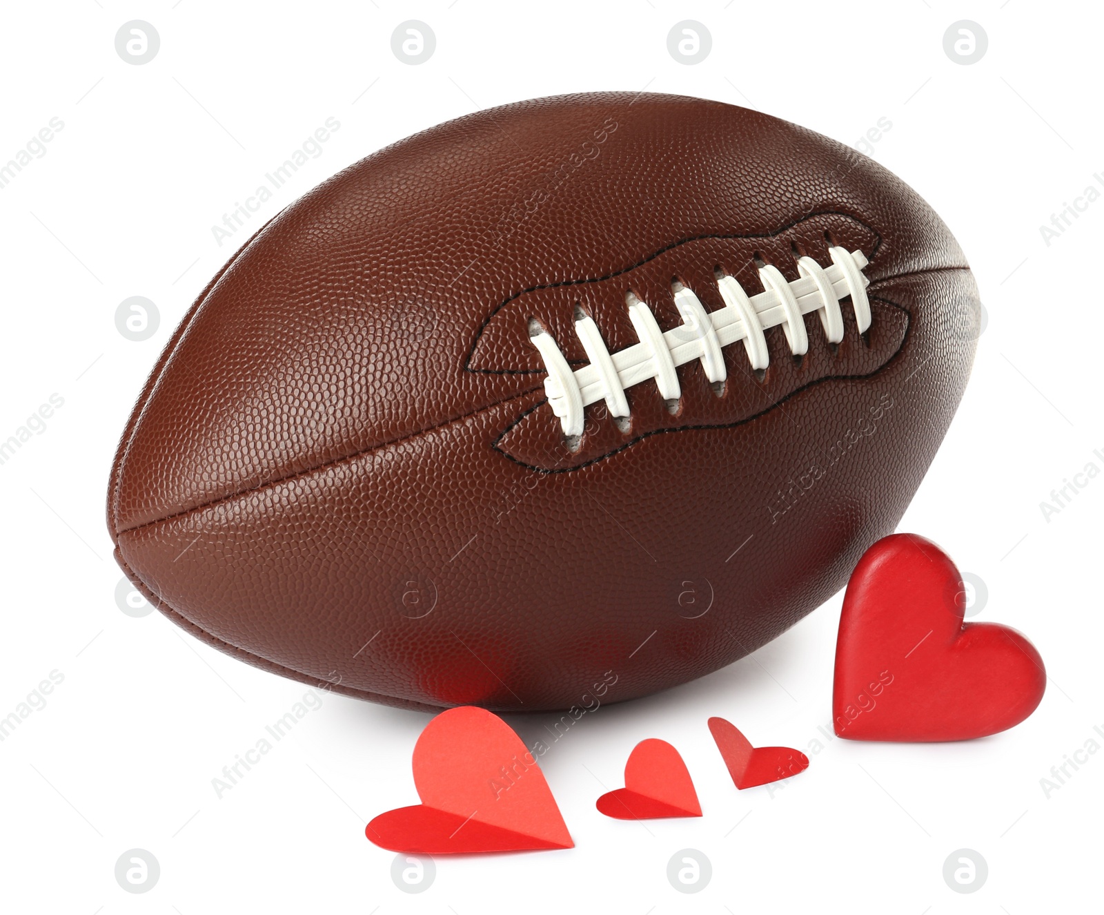 Photo of American football ball and hearts on white background