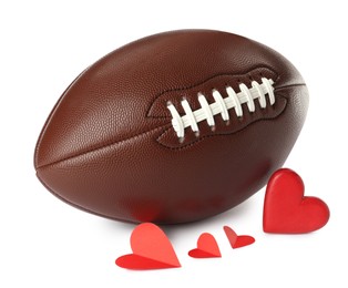 Photo of American football ball and hearts on white background