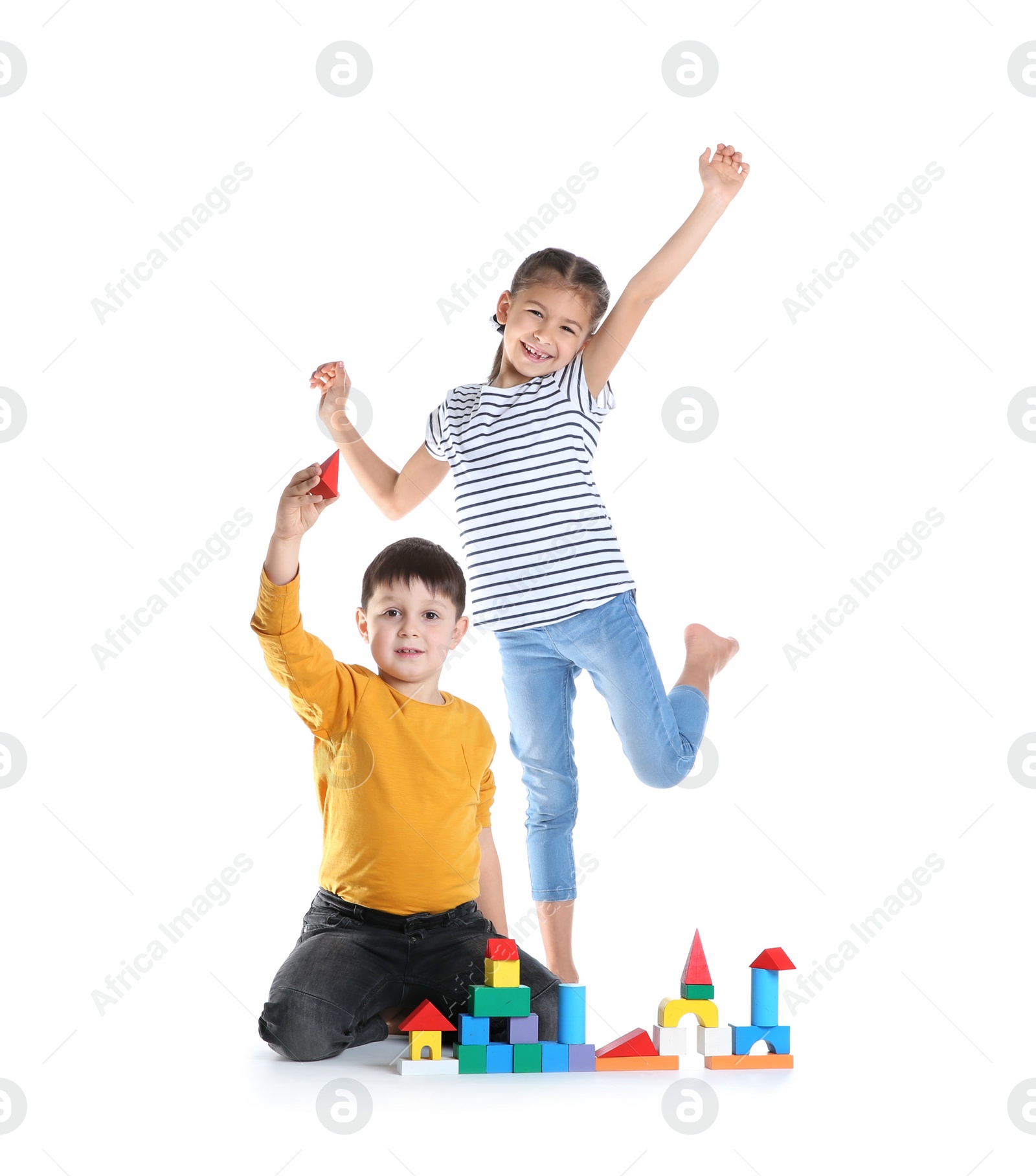 Photo of Cute children playing with colorful blocks on white background