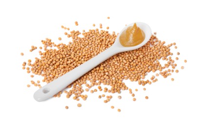 Photo of Fresh tasty mustard sauce in spoon and dry seeds isolated on white